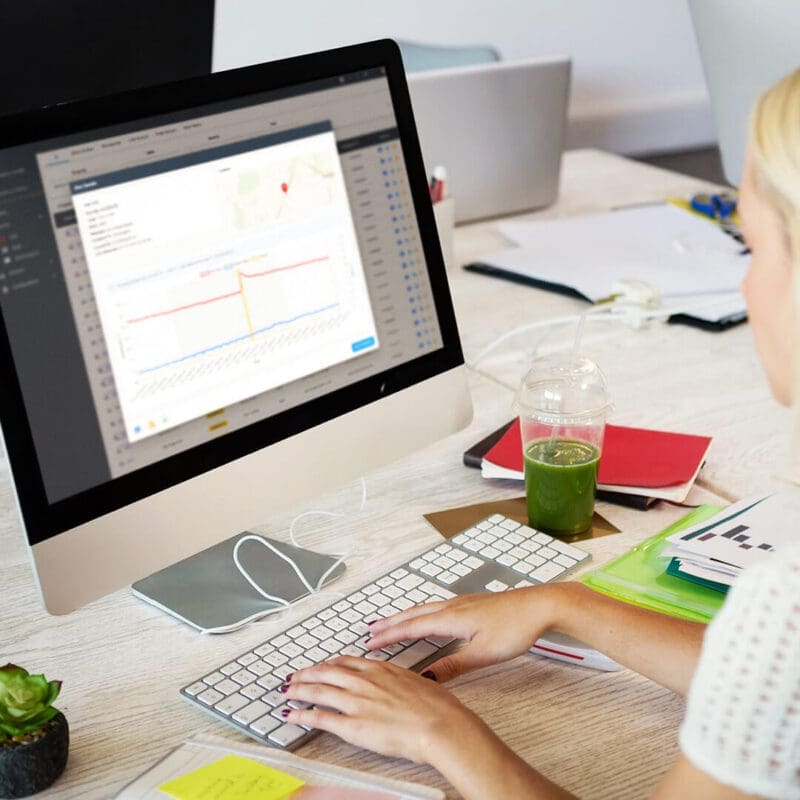 Root Cause Diagnostics Case Study Featured Image - Woman at Computer